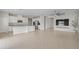 Open-concept kitchen and living area with granite countertops, stainless steel appliances, and ample cabinet space at 1616 Eucalyptus Way, Davenport, FL 33837