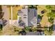 Aerial view of the home featuring dark roof, trampoline, backyard patio, and well manicured lawn at 1667 Spring Loop Way, Winter Garden, FL 34787