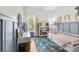 Bright bedroom with board and batten, comfortable bed, desk area and large window allowing natural light at 1667 Spring Loop Way, Winter Garden, FL 34787
