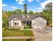 Charming home featuring a spacious two car garage, beautifully landscaped front yard, and stone accents at 1667 Spring Loop Way, Winter Garden, FL 34787