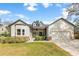 Charming single Gathering home featuring a landscaped front yard and welcoming entrance on a clear day at 1667 Spring Loop Way, Winter Garden, FL 34787