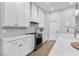 Modern kitchen featuring white cabinetry, stainless steel appliances, and a bright design at 1667 Spring Loop Way, Winter Garden, FL 34787