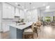 Bright kitchen with modern appliances, island with seating, and a stylish design at 1667 Spring Loop Way, Winter Garden, FL 34787