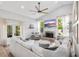 Inviting living room featuring a brick fireplace, vaulted ceiling, and access to outdoor space at 1667 Spring Loop Way, Winter Garden, FL 34787