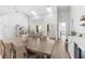 Open living space featuring a dining table, kitchen and seating area at 1667 Spring Loop Way, Winter Garden, FL 34787
