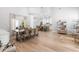Open living space featuring a dining table, kitchen and seating area at 1667 Spring Loop Way, Winter Garden, FL 34787