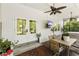 Cozy patio featuring a dining area and TV with a relaxing space for outdoor enjoyment and entertaining at 1667 Spring Loop Way, Winter Garden, FL 34787