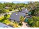 An aerial view of the home and the pool area, surrounded by lush landscaping, provides privacy and outdoor enjoyment at 169 Winding Oaks Ln, Oviedo, FL 32765