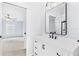 Updated bathroom featuring a vanity with black hardware and a frameless mirror at 169 Winding Oaks Ln, Oviedo, FL 32765