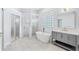 Luxury bathroom featuring a soaking tub, walk-in shower, and modern fixtures at 169 Winding Oaks Ln, Oviedo, FL 32765