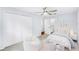 Bright bedroom featuring neutral walls, carpet, ceiling fan, closet, and furnishings at 169 Winding Oaks Ln, Oviedo, FL 32765