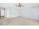 Spacious bedroom with tray ceiling and ceiling fan at 169 Winding Oaks Ln, Oviedo, FL 32765
