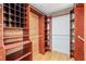 Walk-in closet with custom wood shelving at 169 Winding Oaks Ln, Oviedo, FL 32765