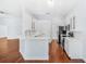 Bright kitchen with white cabinets, stainless steel appliances, and breakfast bar at 169 Winding Oaks Ln, Oviedo, FL 32765
