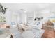 Bright and airy living room featuring hardwood floors and an open layout at 169 Winding Oaks Ln, Oviedo, FL 32765