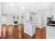 Spacious living room with hardwood floors, fireplace, and open kitchen concept at 169 Winding Oaks Ln, Oviedo, FL 32765