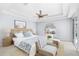 Bright bedroom with tray ceiling, a ceiling fan, and a beach themed decor at 169 Winding Oaks Ln, Oviedo, FL 32765