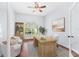 Comfortable office featuring large arched window, hardwood flooring, and a wooden desk at 169 Winding Oaks Ln, Oviedo, FL 32765