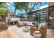 Brick patio with an outdoor kitchen, grill, and comfortable seating at 169 Winding Oaks Ln, Oviedo, FL 32765