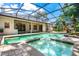 Backyard pool with spa and patio area, perfect for outdoor entertaining and relaxation with easy access to the home at 169 Winding Oaks Ln, Oviedo, FL 32765