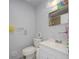 Clean bathroom with a single sink vanity, standard toilet, and a tiled shower at 1708 Nebraska Ave, Kissimmee, FL 34744