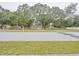 Charming single-story home with mature trees lining the street, offering a serene and inviting atmosphere at 1708 Nebraska Ave, Kissimmee, FL 34744