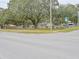Corner lot featuring a single-story home with lush mature trees and street access, providing a serene setting at 1708 Nebraska Ave, Kissimmee, FL 34744