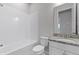 Cozy bathroom featuring a tub and shower combination and granite countertop at 1855 Flora Pass Pl, Kissimmee, FL 34747