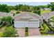 Beautiful paired villas with meticulously landscaped front yard, and two-car garage each at 1855 Flora Pass Pl, Kissimmee, FL 34747