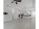 Expansive living area with tile flooring, wall mount for television, and access to the kitchen at 1855 Flora Pass Pl, Kissimmee, FL 34747