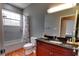 Bathroom featuring granite vanity, tile floor, and a tub with shower at 2300 Dawnwood Ln, Orlando, FL 32809