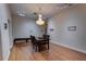Elegant dining room with wood floors, a stylish chandelier, and ample space for entertaining at 2300 Dawnwood Ln, Orlando, FL 32809