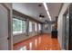 A kitchen area featuring stainless steel appliances, wood cabinets, tile flooring, and modern lighting at 2300 Dawnwood Ln, Orlando, FL 32809