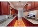 Stylish kitchen featuring granite countertops, plenty of cabinets, and stainless steel appliances at 2300 Dawnwood Ln, Orlando, FL 32809