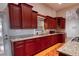 Well-equipped kitchen featuring granite countertops, ample cabinetry, and modern appliances at 2300 Dawnwood Ln, Orlando, FL 32809