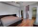 Comfortable main bedroom includes hardwood floors, walk-in closet and a modern platform bed at 2300 Dawnwood Ln, Orlando, FL 32809