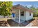 Exterior of a cute shed with a porch at 2300 Dawnwood Ln, Orlando, FL 32809