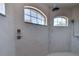 Tiled shower with two windows, shower head and handheld sprayer at 2300 Dawnwood Ln, Orlando, FL 32809