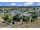 Aerial view of the property showcasing a large backyard, fire pit, and play area at 23520 San Sebastian Ct, Sorrento, FL 32776