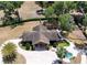An aerial view of a charming community clubhouse, featuring a cozy outdoor seating area and serene surroundings at 23520 San Sebastian Ct, Sorrento, FL 32776