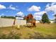 Backyard play area featuring a wooden swing set and a slide for outdoor fun at 23520 San Sebastian Ct, Sorrento, FL 32776