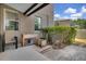 Backyard with a small garden area, potted flowers, and an outdoor chair at 23520 San Sebastian Ct, Sorrento, FL 32776
