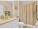 Clean bathroom featuring a shower with a curtain and a single sink vanity at 23520 San Sebastian Ct, Sorrento, FL 32776