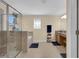 Bathroom featuring a shower with a glass door, a tub, and vanity with a granite countertop at 23520 San Sebastian Ct, Sorrento, FL 32776