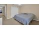 Serene bedroom with soft lighting, a plush bed, and ample closet space for a comfortable living at 23520 San Sebastian Ct, Sorrento, FL 32776