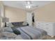 Bedroom with a bed, couch, and view into an adjacent room at 23520 San Sebastian Ct, Sorrento, FL 32776