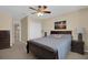 Inviting bedroom with neutral tones, a bed with a patterned quilt, and ample closet space at 23520 San Sebastian Ct, Sorrento, FL 32776