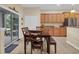 Dining area featuring wood table and chairs with natural light from sliding glass doors at 23520 San Sebastian Ct, Sorrento, FL 32776