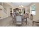 Elegant dining room showcasing a traditional china cabinet and staircase, blending classic charm with modern living at 23520 San Sebastian Ct, Sorrento, FL 32776