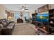Spacious game room complete with TV, sofa, arcade game, and neutral carpeting at 23520 San Sebastian Ct, Sorrento, FL 32776